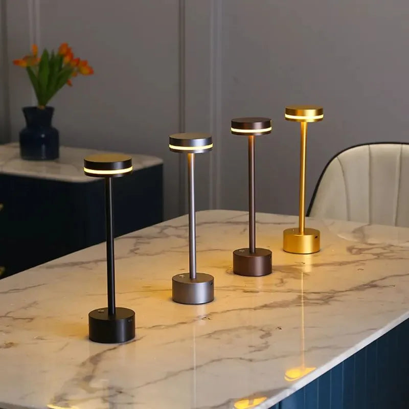 Touch dimmable LED table lamp by Nvroome, rechargeable & cordless, offering versatile accent light.