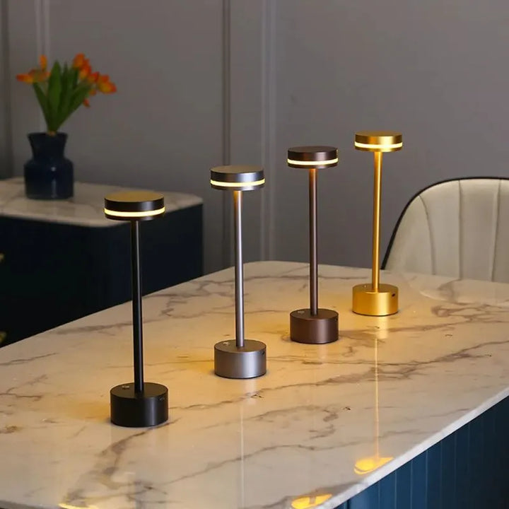 Touch dimmable LED table lamp by Nvroome, rechargeable & cordless, offering versatile accent light.