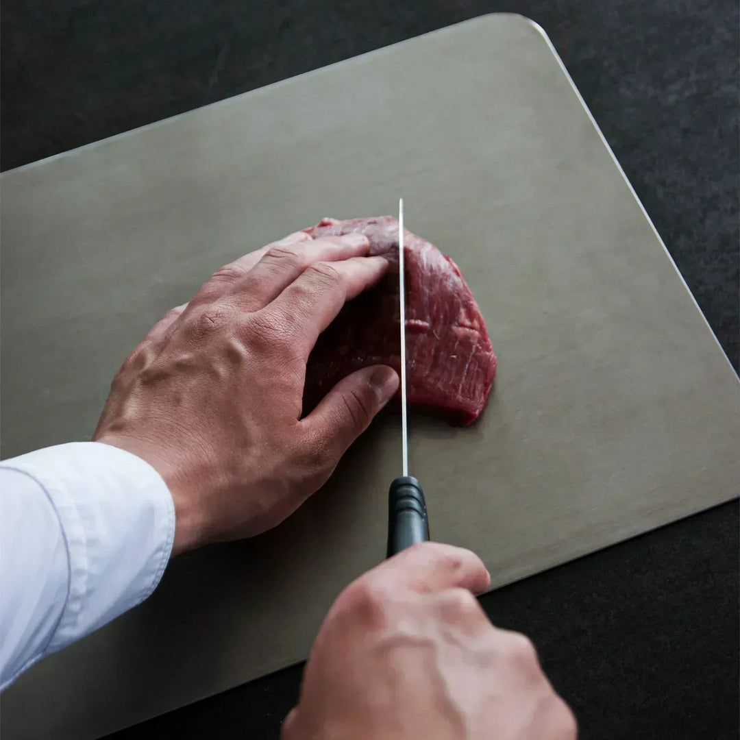 Robust titanium cutting board for safe and healthy food preparation. An essential, long-lasting kitchen tool.
