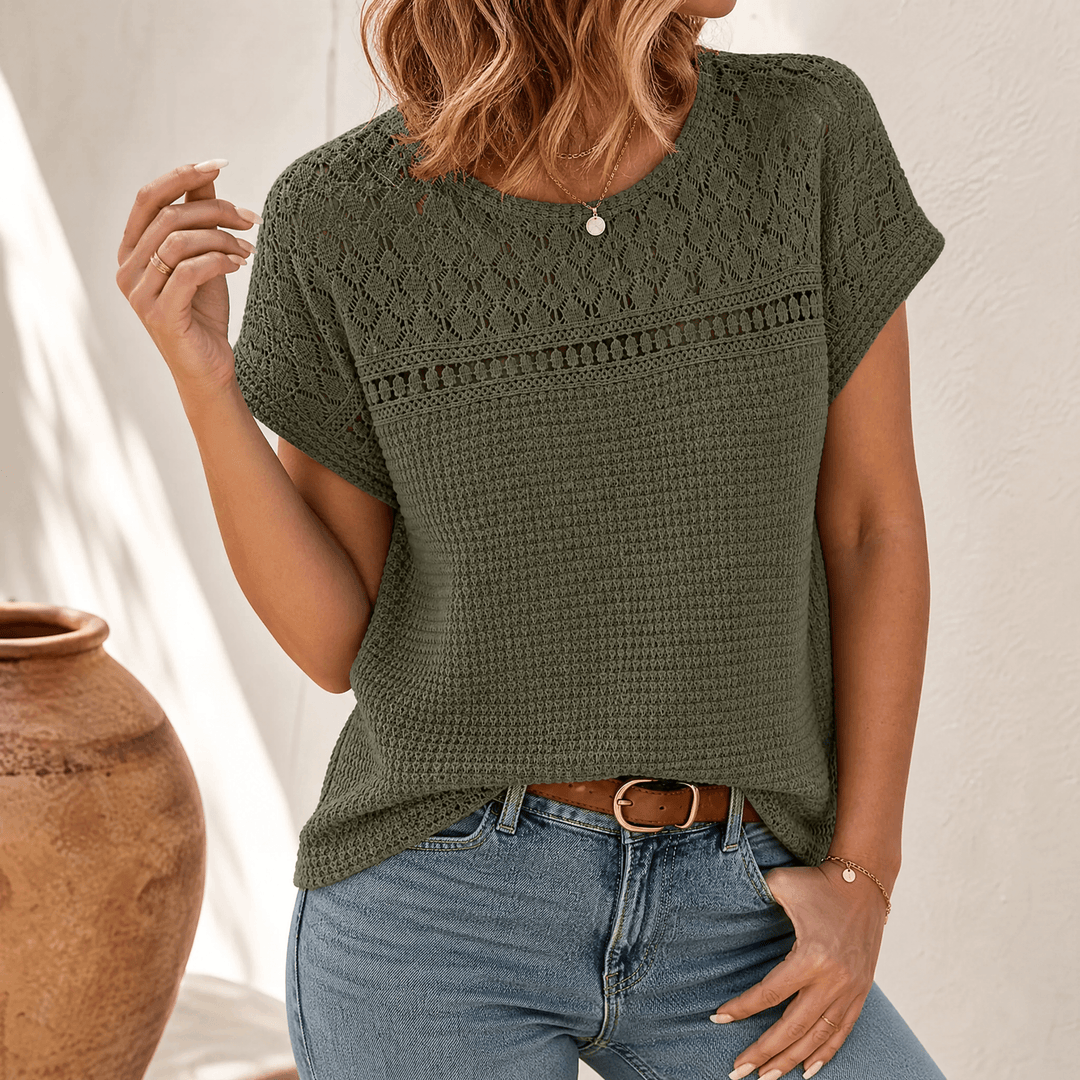 Chic women's knit top, short sleeve, open weave pattern for a stylish bohemian look.