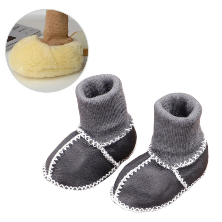 Pair of colorful non-slip baby slippers, ideal for toddlers learning to walk.