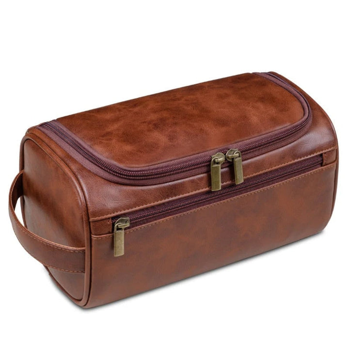 Close-up of premium brown leather unisex dopp kit, highlighting durable texture for travel & daily use.