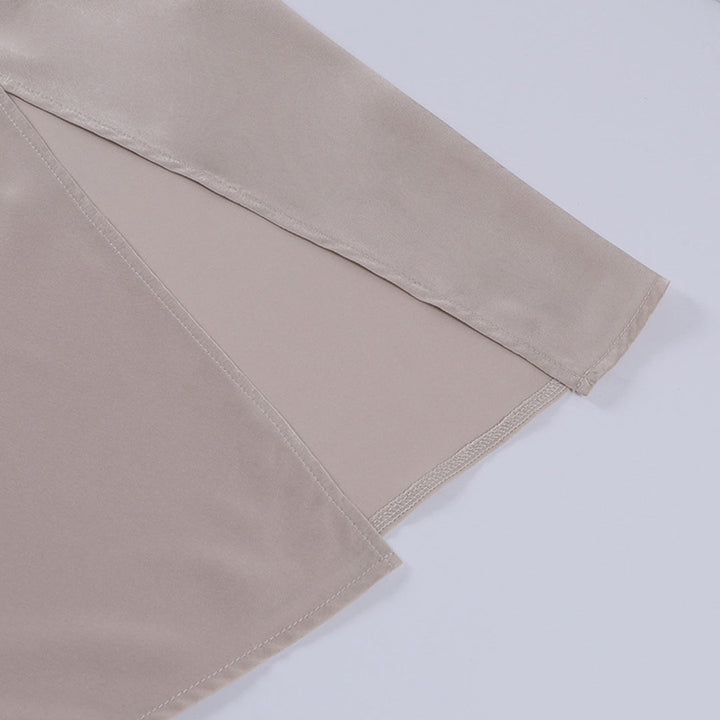 Close-up of the elegant V-neck and fabric of the Elara maxi dress, perfect for chic evening and party wear.