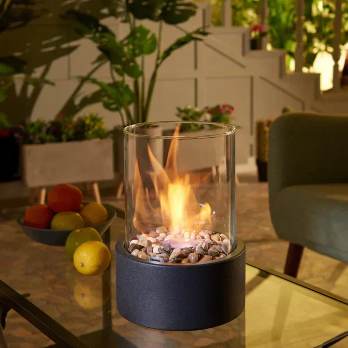 Portable tabletop fire pit lantern, creating warm ambiance for indoor & outdoor decor.
