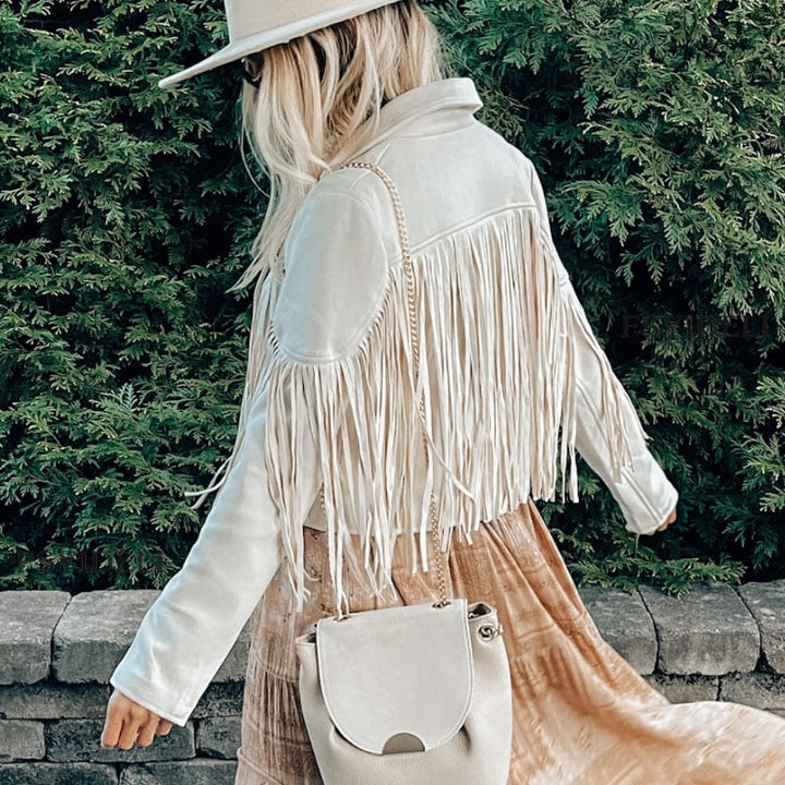 Elegant women's suede jacket with tassels. Boho chic style, versatile for spring & fall outfits.