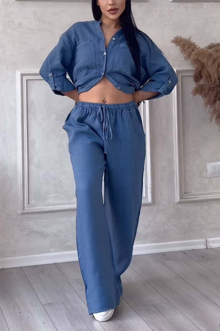 Fashionable women's linen co-ord set: comfortable blouse and wide-leg trousers for vacation.