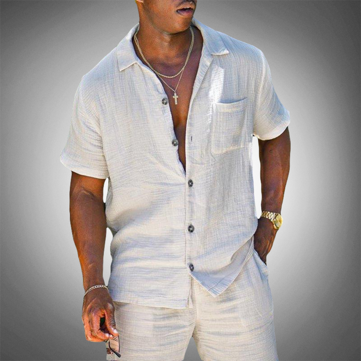 Stylish men's white two-piece casual outfit set for summer. Comfortable matching leisure wear for men's fashion.