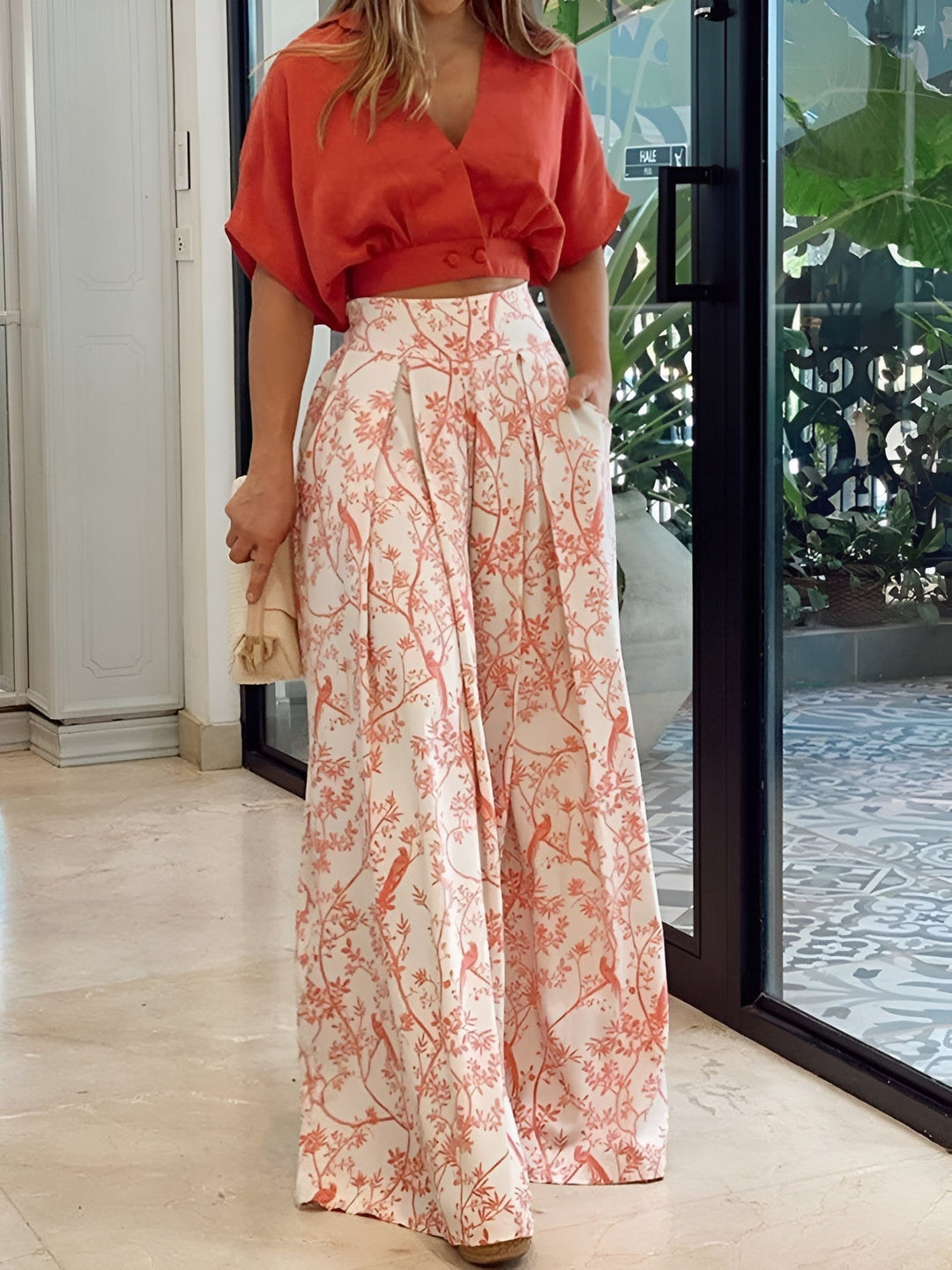 Elegant women's two-piece summer outfit. Relaxed fit top & bottoms, ideal for versatile casual summer wear.