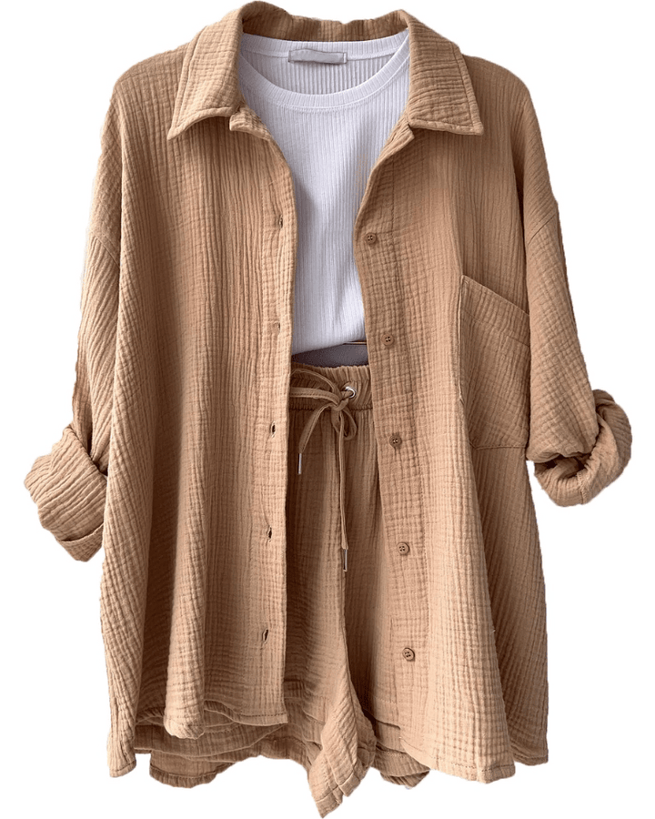 Elegant women's two-piece summer collection outfit, including a fashionable shirt and matching casual trousers.