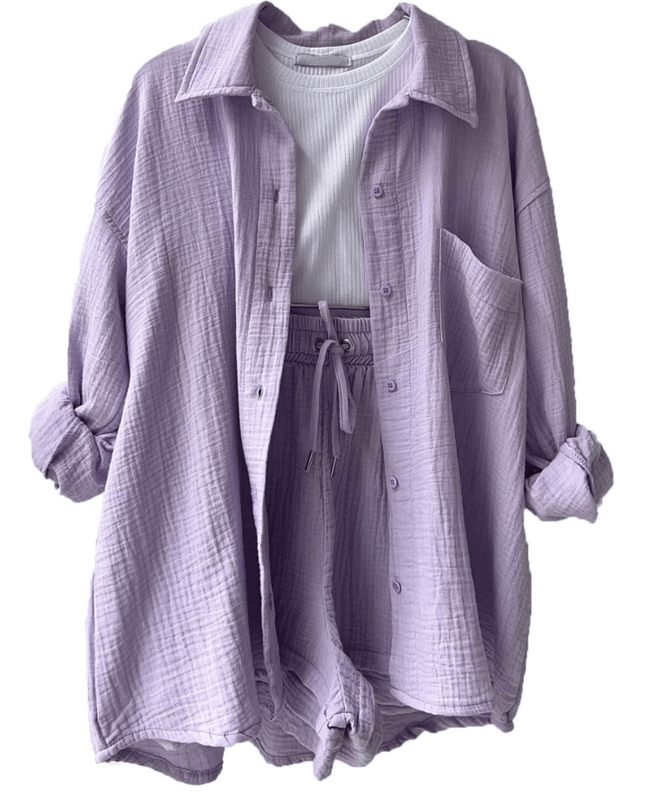 Lightweight women's summer outfit, a versatile two-piece with a button-up shirt and relaxed trousers for everyday wear.