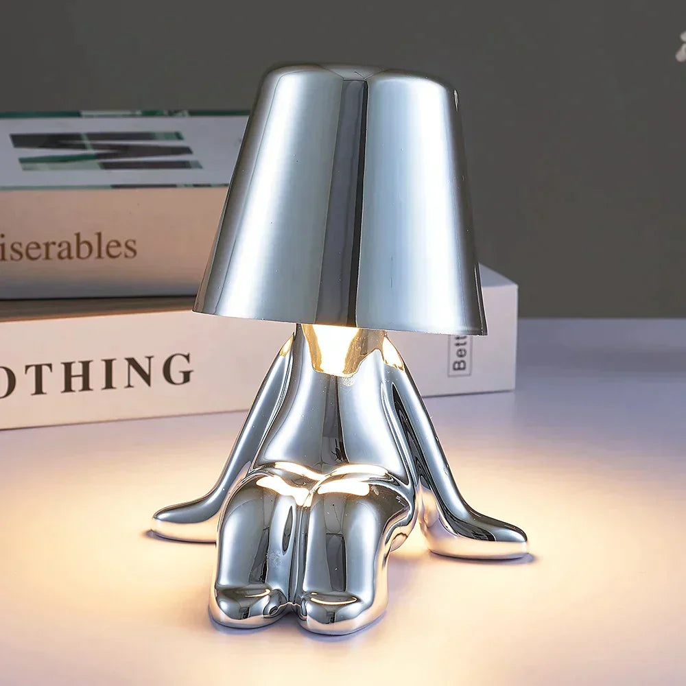 Contemporary LED table lamp, rechargeable, dimmable, creates a warm atmosphere.