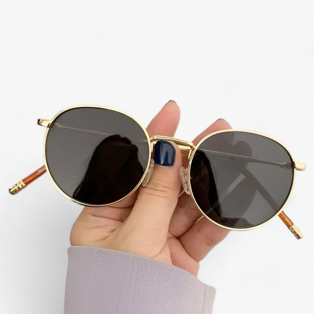 Premium unisex round metal frame eyewear, Nova sunglasses offering durable design & full UV protection.