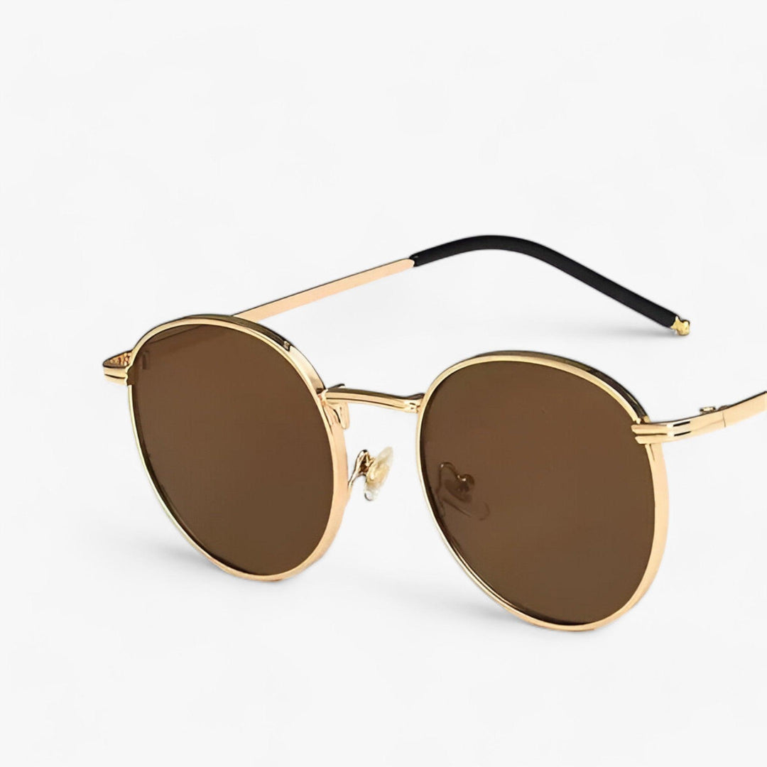 Designer Nova round metal frame sunglasses, a classic unisex fashion accessory for stylish UV protected eyewear.