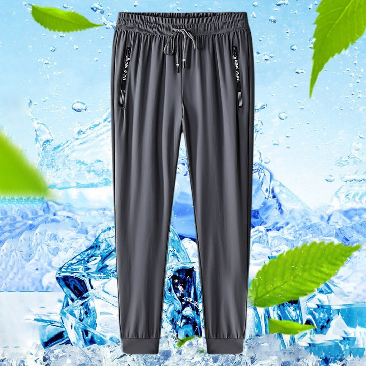Black unisex quick-dry stretch hiking pants with secure zippered pockets.