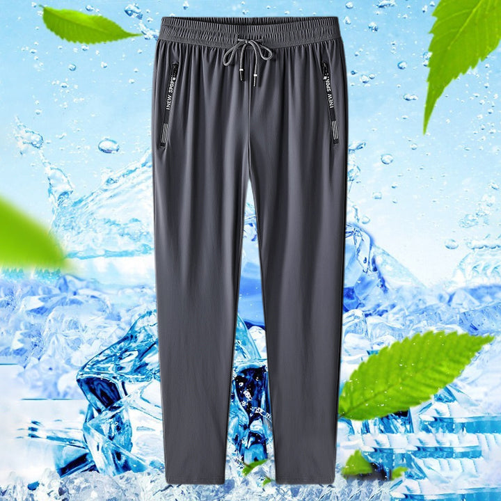 Unisex stretch travel pants featuring an adjustable waist & quick-dry fabric.