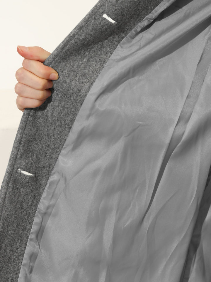 Sophisticated women's single-breasted trench coat, tailored for winter elegance, perfect outerwear.