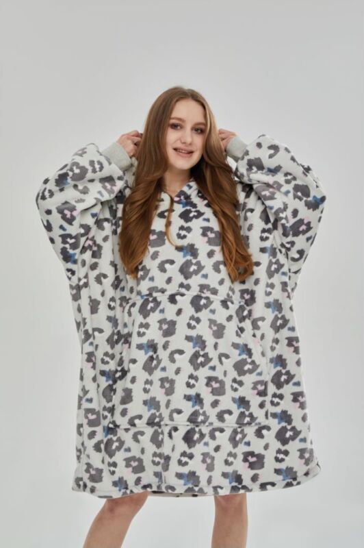 Bulk display of assorted oversized hoodie blankets, showcasing solid colors & quality.