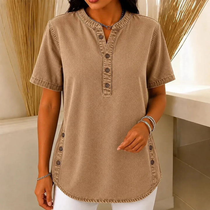 Close-up of side buttons on a women's Henley tunic top, a stylish short sleeve casual shirt.