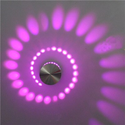 Unique spiral LED fixture by Nvroome, perfect as a wall sconce or ceiling light. Modern ambient lighting.
