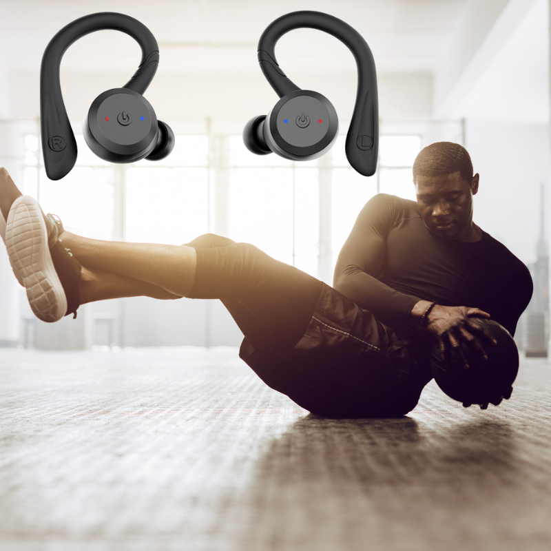 Active person enjoying music with unisex waterproof wireless fitness earbuds during a gym session.