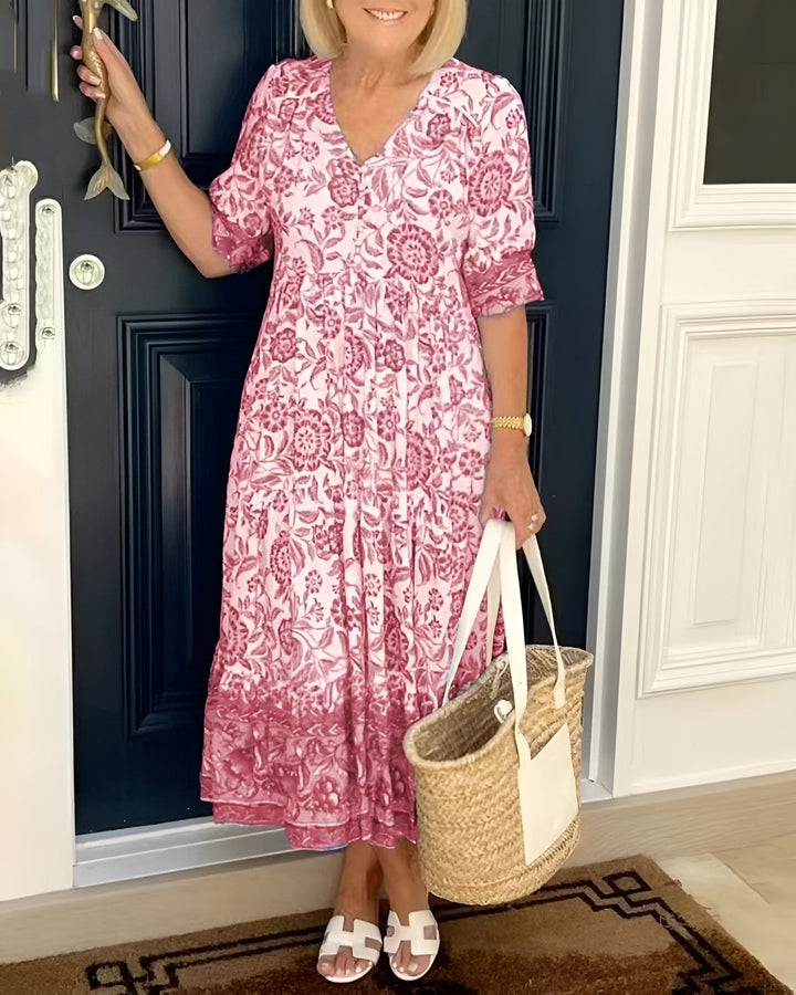 Effortless women's floral midi dress, a comfortable summer essential with V-neck and 3/4 sleeves for vacation.
