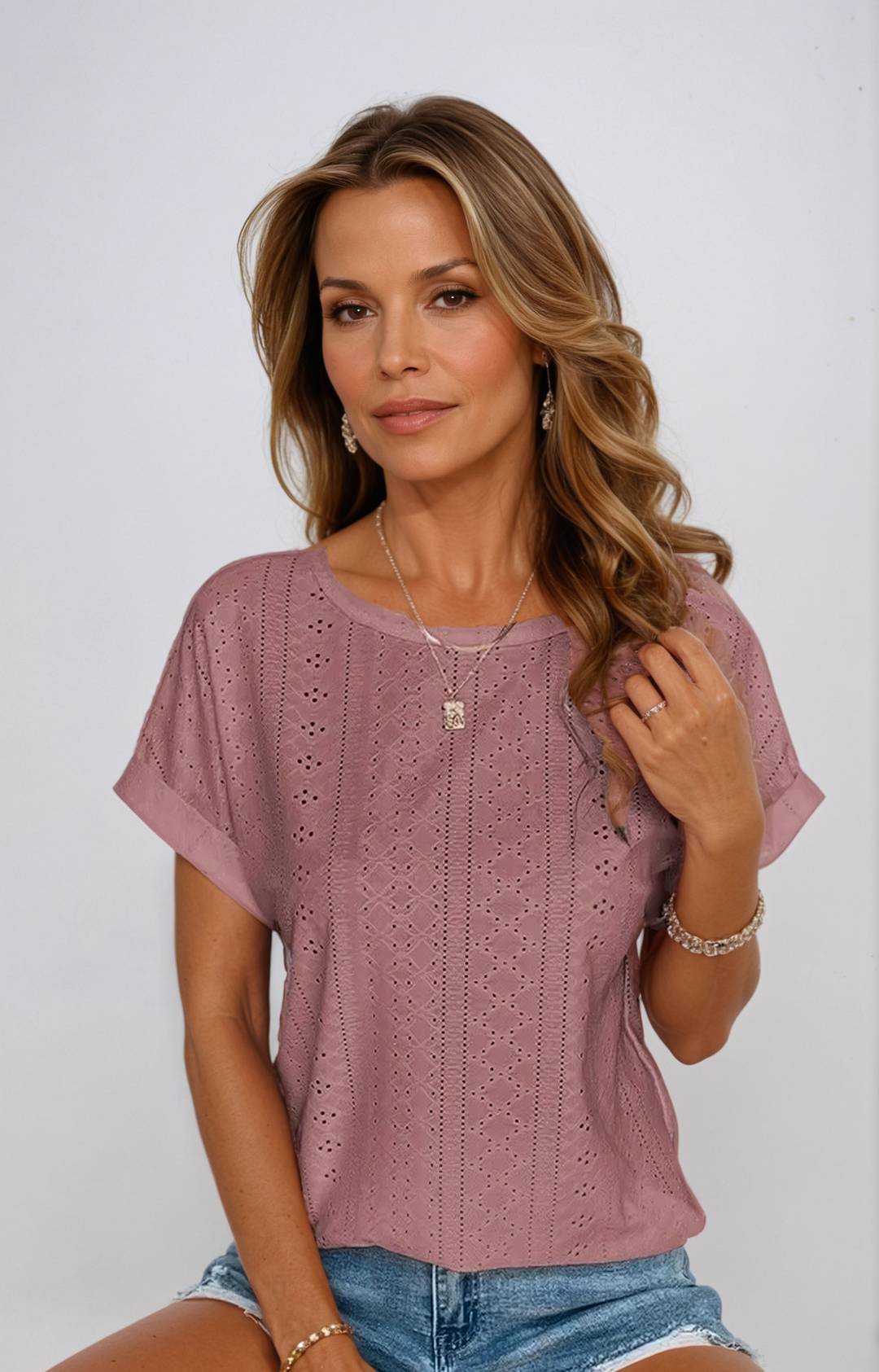 Chic casual eyelet top for women, short sleeves, relaxed silhouette, great for summer outfits.