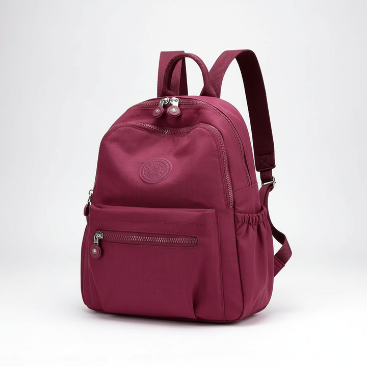 Lightweight nylon mini backpack with secure compartments, ideal for travel, school, or daily essentials.
