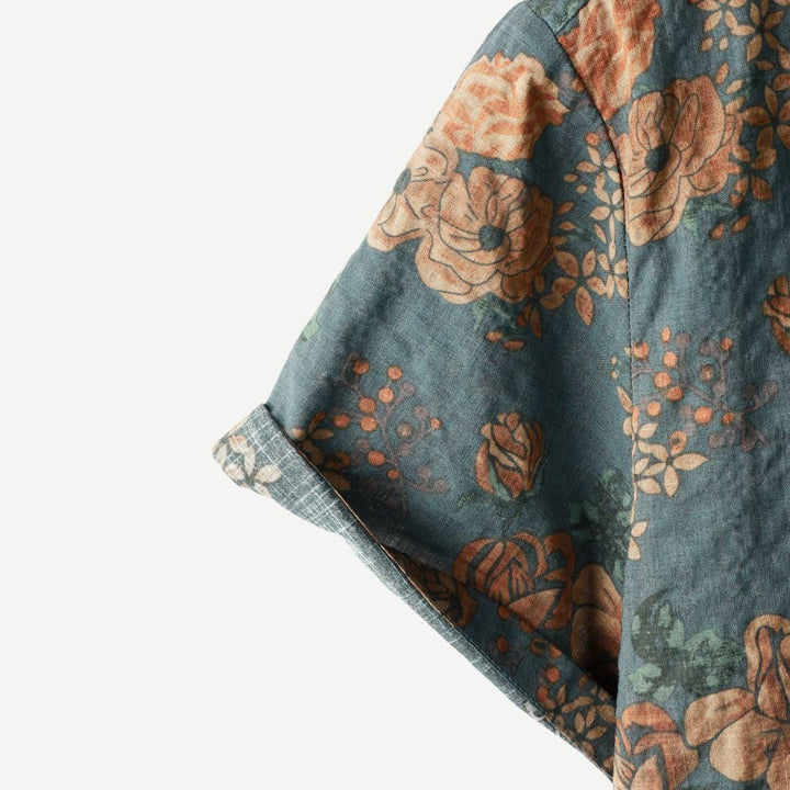 Men's patterned short sleeve button down shirt with a classic floral Hawaiian design, great for casual summer fashion.