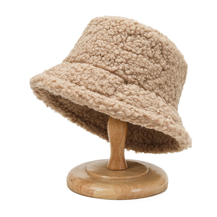 Plush women's teddy bucket hat, providing ultimate warmth and a trendy look for winter outfits.