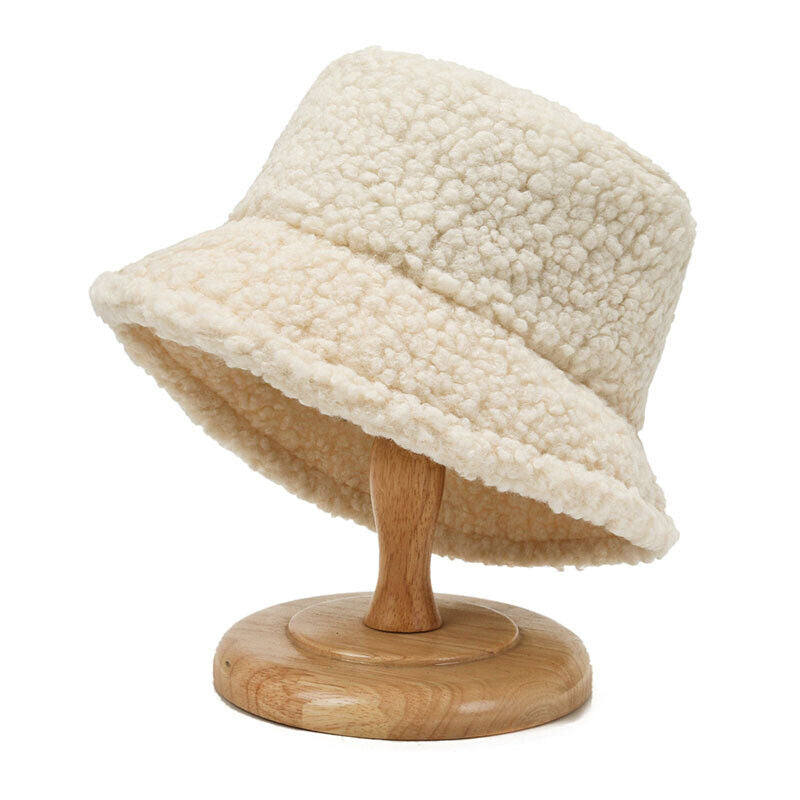 Warm and cozy women's cream teddy bucket hat, essential winter headwear for stylish comfort.
