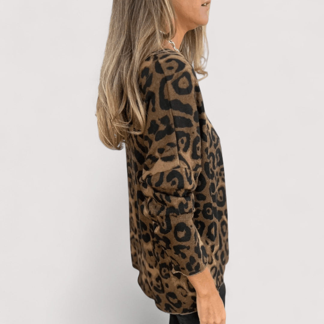 Versatile women's long sleeve top featuring a stylish leopard animal print. Relaxed fit, ideal for daily wear.