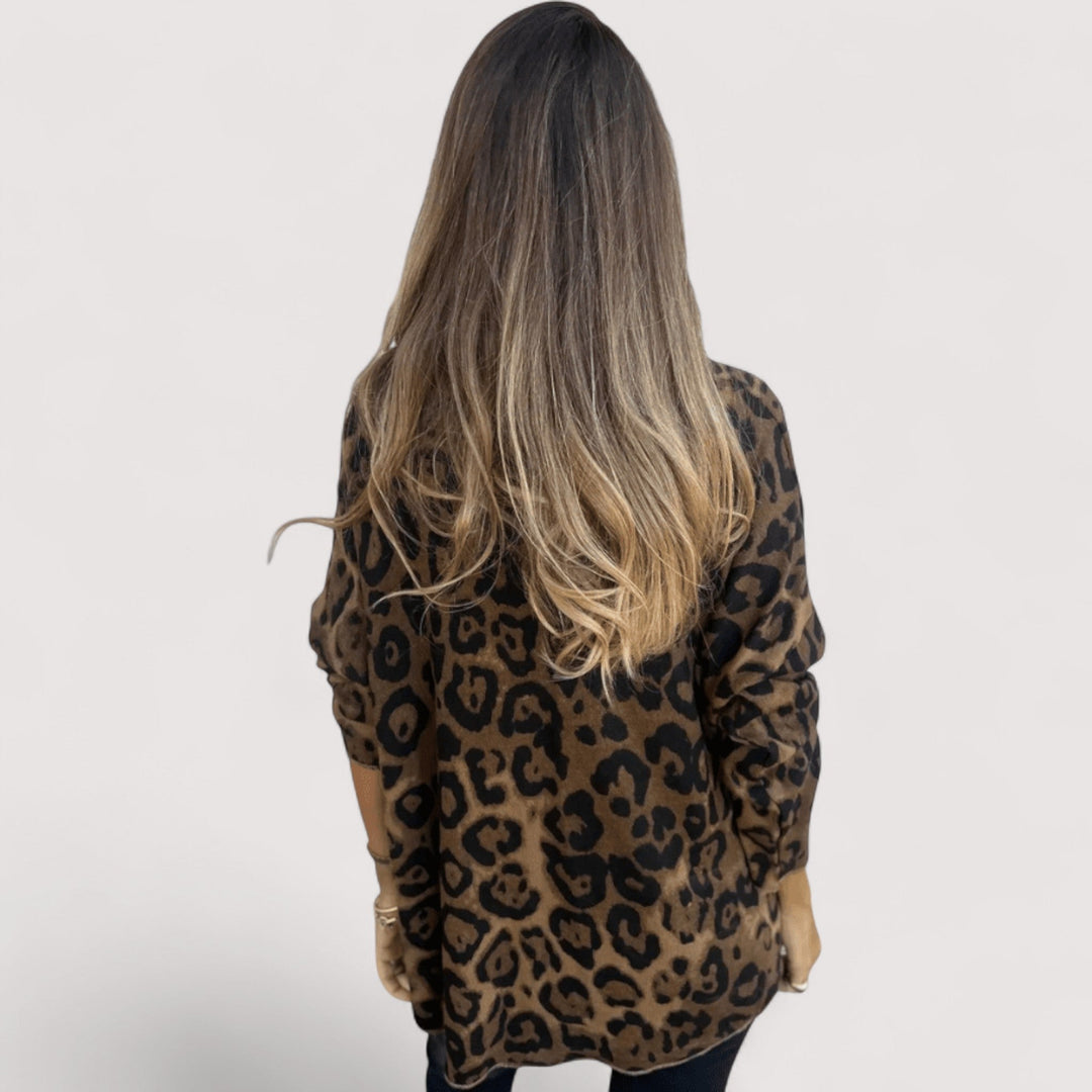 Women's round neck long sleeve top in a fashionable leopard print. Comfortable & chic animal print pullover.