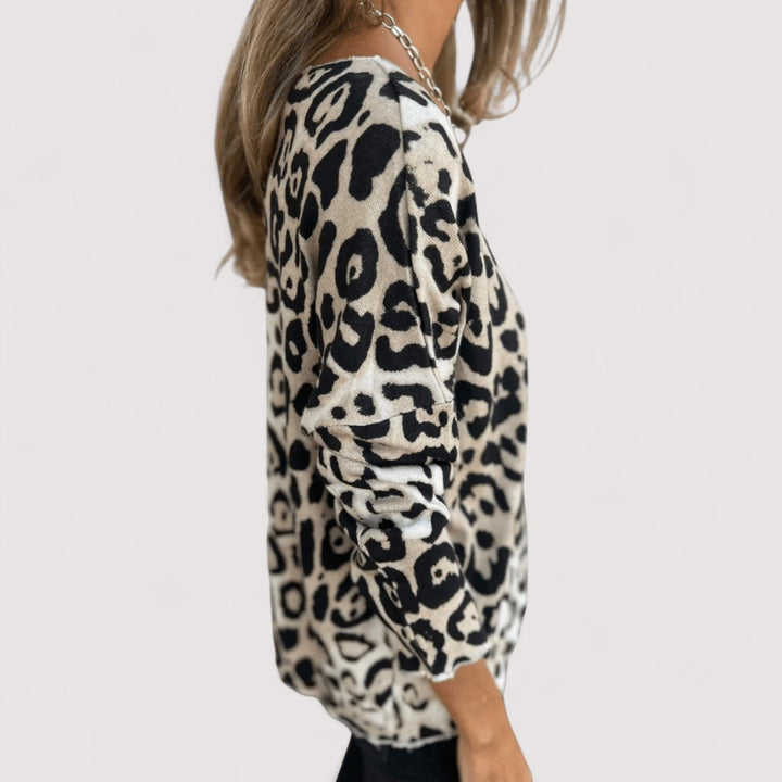 Trendy women's long sleeve leopard print top with a relaxed fit. Chic animal print for versatile casual styling.