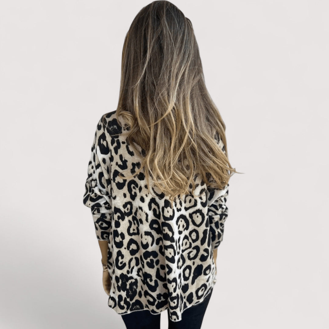 Women's chic leopard print long sleeve top. Relaxed fit animal print pullover, comfortable for everyday wear.