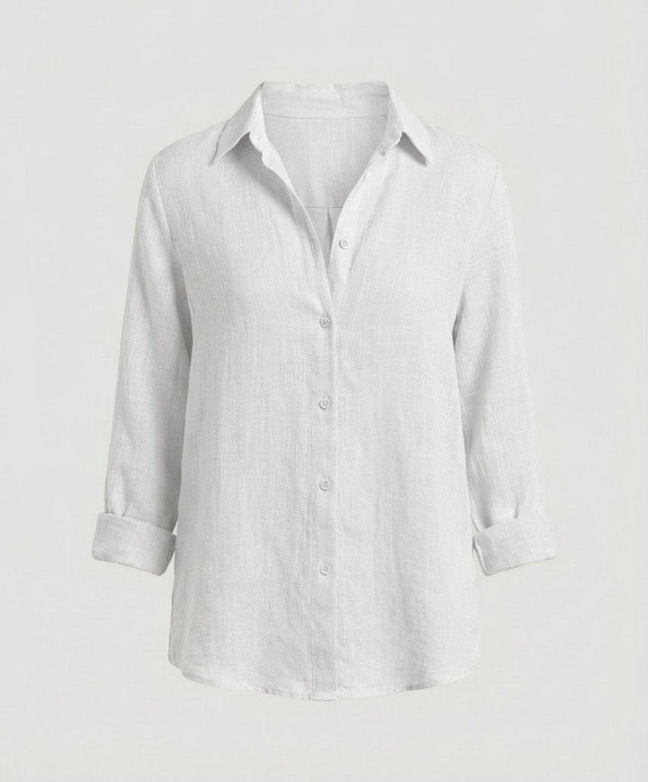 Timeless women's relaxed-fit button-up shirt offers comfortable everyday wear & chic casual style.