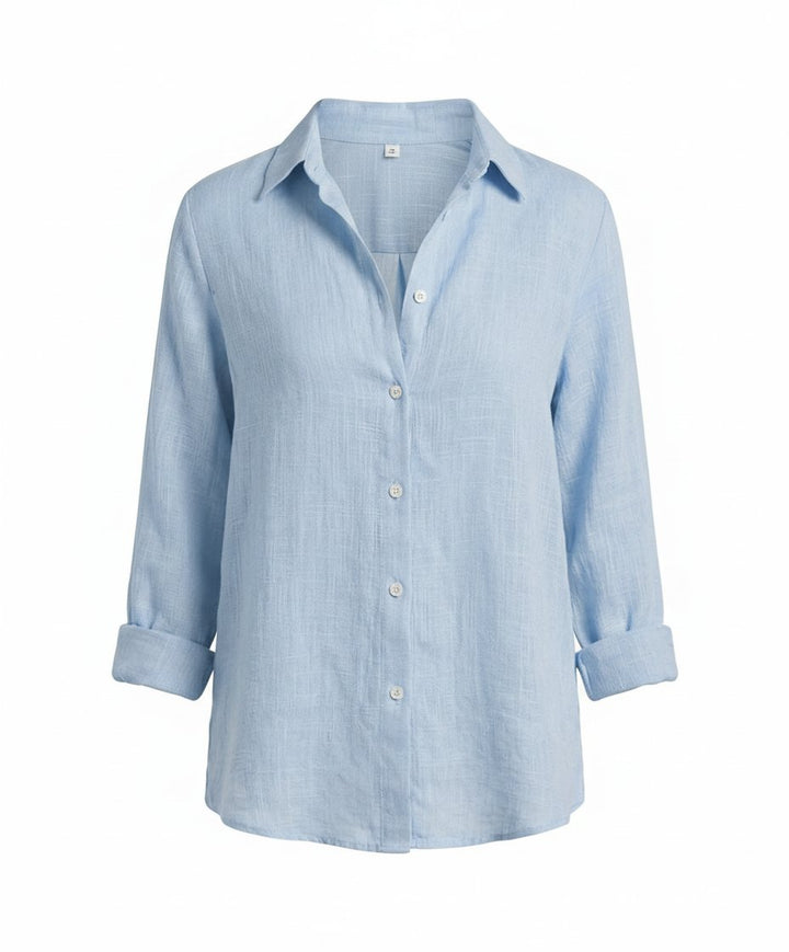 Classic women's button-up shirt in a relaxed fit, a staple versatile top for casual fashion.