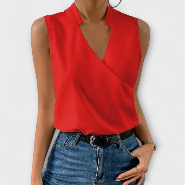 Lightweight women's sleeveless wrap blouse, a comfortable v-neck collared top for summer wardrobe.