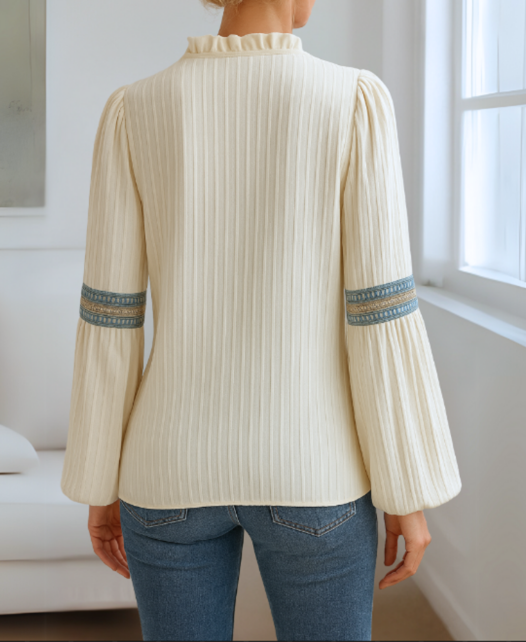Detailed women's V-neck long sleeve blouse, featuring unique embroidery for a refined casual look.