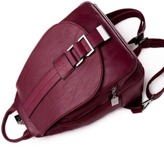 Durable women's leather backpack, water-resistant finish. Anti-theft design for travel safety.