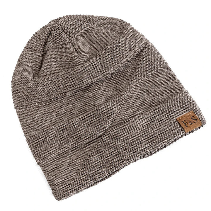 Stylish unisex winter beanie with a soft fleece lining, great for fashion in cold weather.