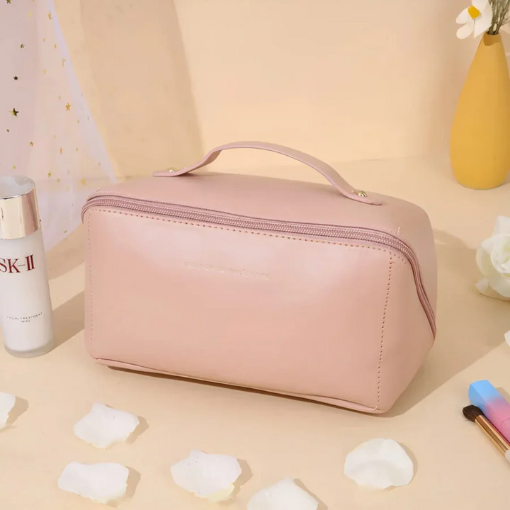 Women's waterproof travel makeup bag with compartments, ideal for organized beauty essentials.