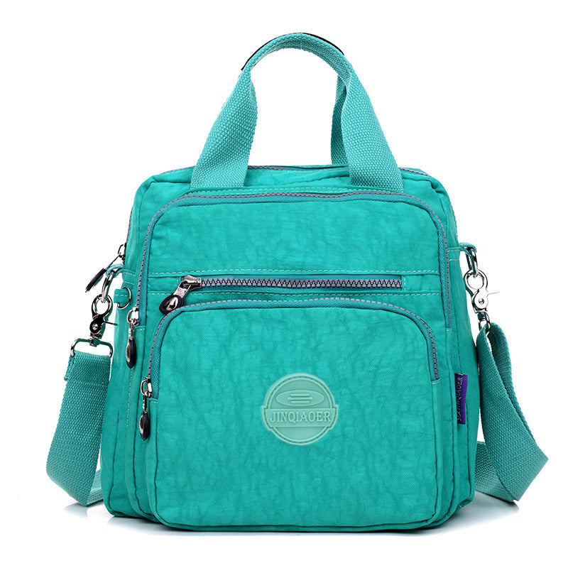 Practical women's waterproof crossbody bag for travel. Secure zipper closure, ideal everyday versatile shoulder bag.