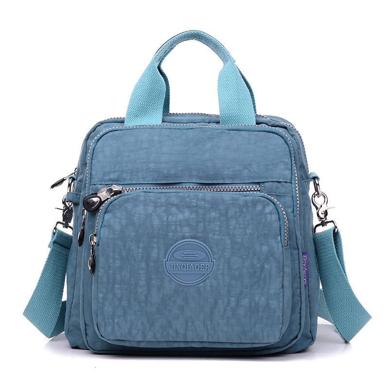 Convertible women's waterproof crossbody bag, functions as a shoulder bag, handbag, or mini backpack purse.