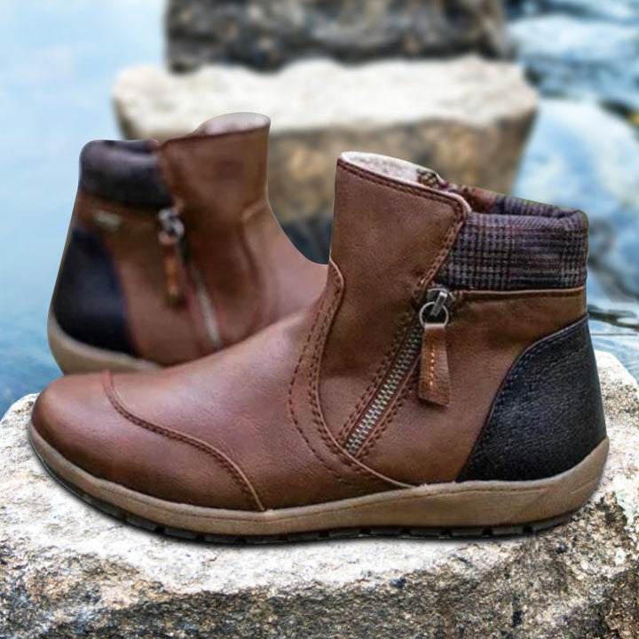 Fashionable women's waterproof boots with orthopedic support & easy-on zipper. All-day comfort.