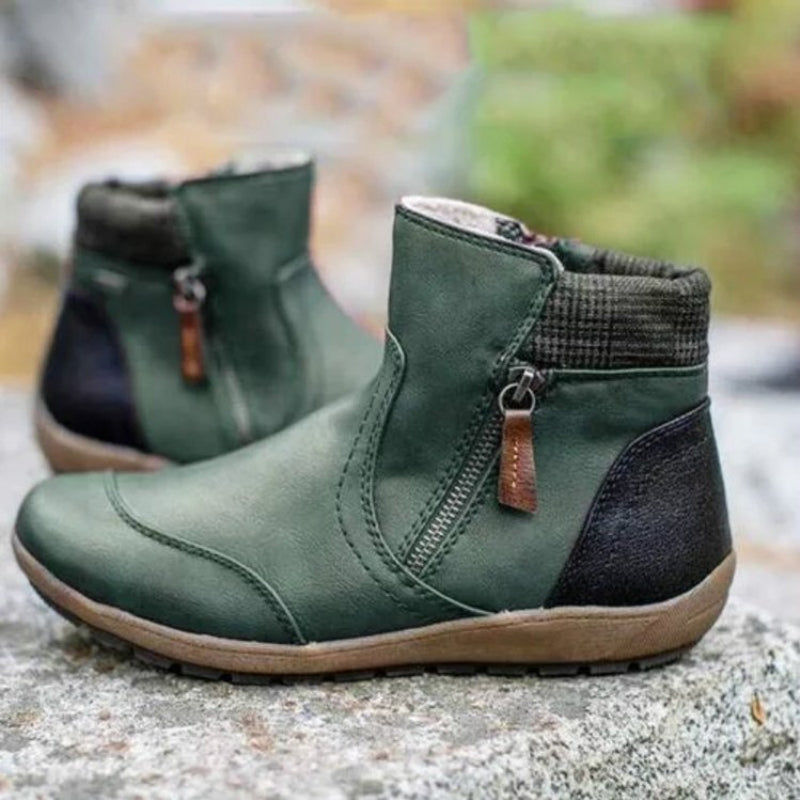 Black women's waterproof orthopedic boots with a practical side zipper. Durable all-weather footwear.