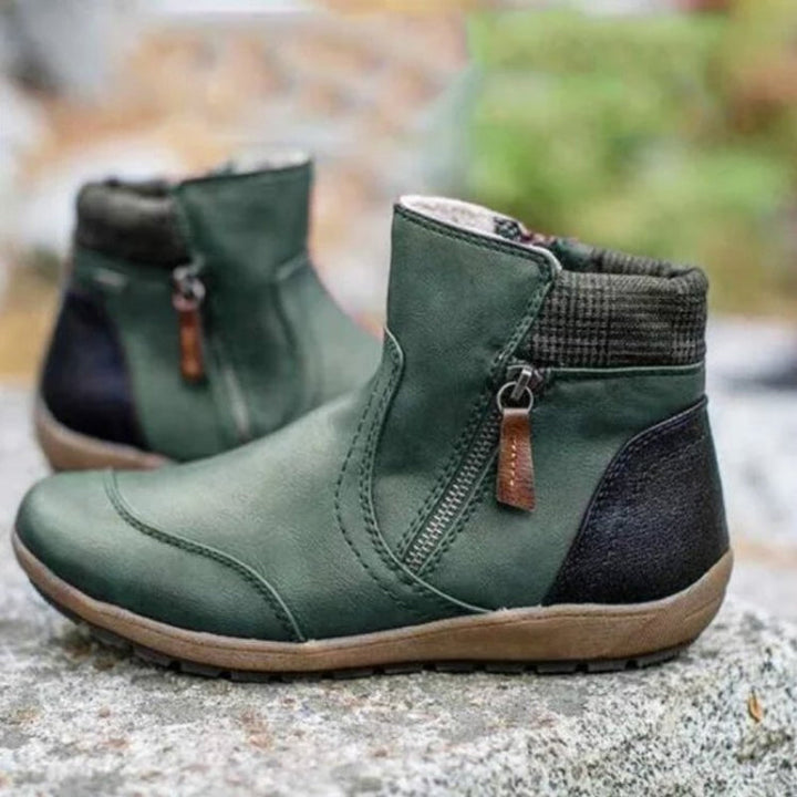 Close-up of women's waterproof orthopedic zipper boots. Focus on non-slip sole & stylish design.