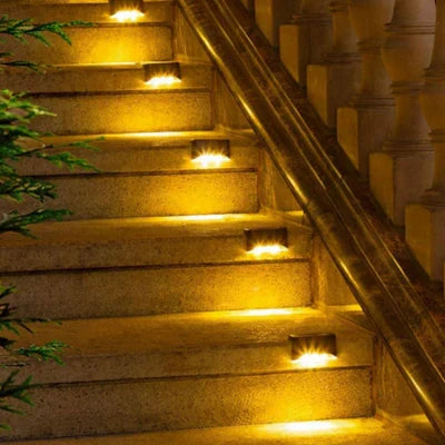 Waterproof solar garden light illuminating a pathway, perfect for outdoor landscape lighting.