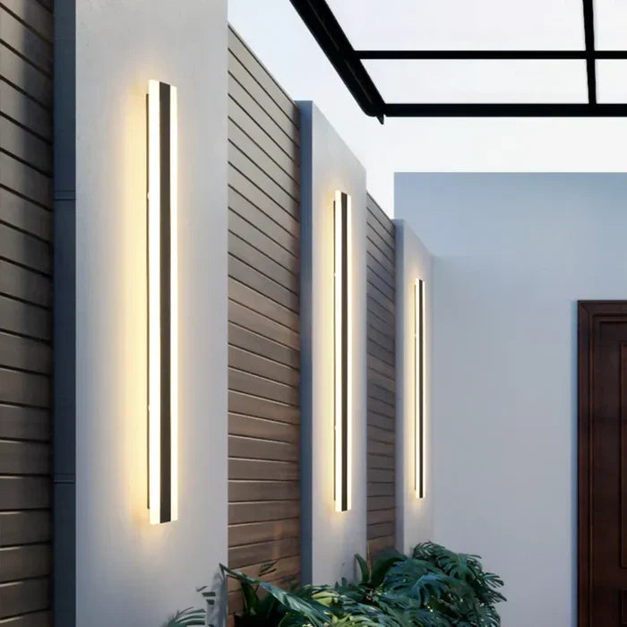 Modern LED outdoor wall light for patio/garden, sleek design, energy-efficient warm/cold white exterior lighting.