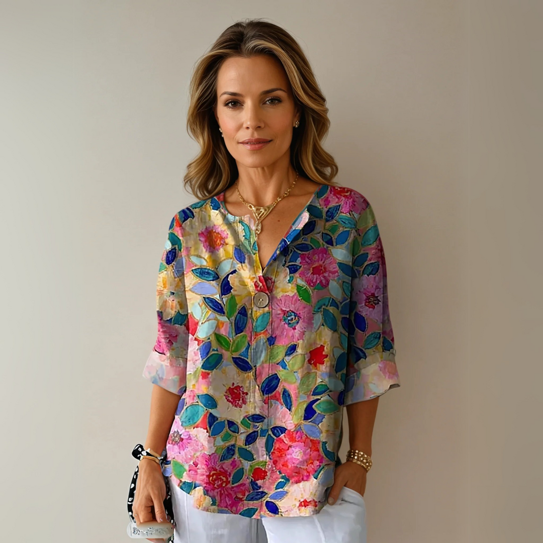 Women's floral V-neck blouse in a relaxed fit, perfect for casual chic summer fashion.
