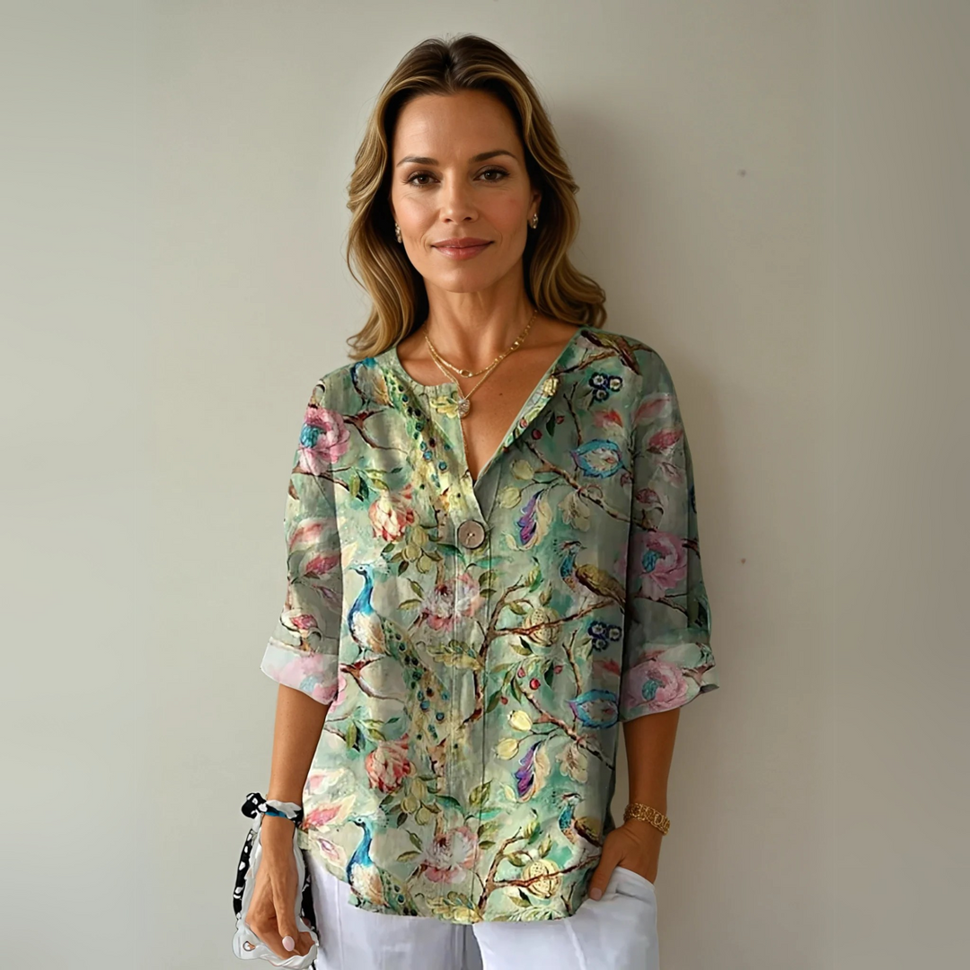 Casual chic women's blouse featuring a vibrant floral print and comfortable V-neck design.